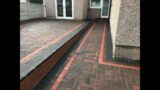 Brindle Paved Patio with Charcoal and Terracotta Edging in Holywell,  Flintshire