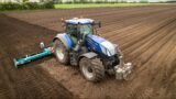 New Holland fleet planting potatoes