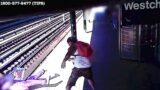 Man Throwing Woman Onto Train Tracks