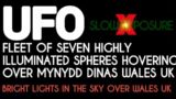 UFO – Fleet of 7 self illuminating sphere UAP over Wales UK. Bright lights hung in the sky.