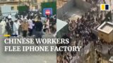 Chinese workers flee world’s largest iPhone factory after Covid outbreak