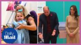 Little girl runs in front of Prince William and Kate Middleton during speech