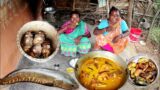 santali tribe grandma cooking & eating SNAKE HEAD FISH with taro root for their lunch menu