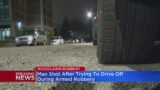 Man shot after trying to drive off during armed robbery in Woodlawn