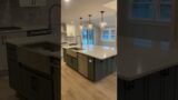 One more kitchen completed, stunning kitchen, huge island, and beautiful white countertops