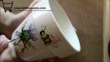 Scotland's Thistle symbol combined with a bee hand painted on terracotta pot | Emerald Blossoms