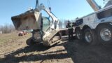 buried skid steer. 1150R to the rescue.