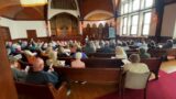 Congregants of Mass. church destroyed by fire attend Sunday services in neighboring town