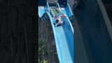 Wife laughs as husband scales waterpark slide to rescue stuck daughter #Shorts