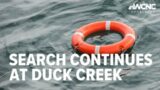 Water rescue operation being conducted after two people were swept into Duck Creek