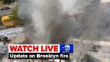 LIVE | Officials give update on fire tearing through Brooklyn stores