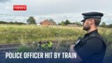 Officer in serious condition after being hit by train while saving distressed man