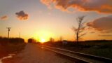 4K Ultra HD Footage – timelapse slo mo sunset train tracks beautiful crimson relaxing soothing calm
