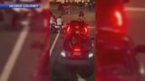 CAUGHT ON CAMERA: Video shows biker jump on car, smash windshield with children inside