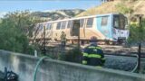 Derailed BART train back on the track