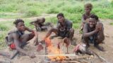 !WHAT A GREAT VALENTINE!s DAY! HADZABE ROASTING THEIR BIG CATCH: HADZABE TRIBE HUNTERS IN TZ