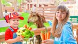 Diana & Roma feed the Animals at the Emirates Park Zoo