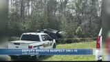 Suspect shot trying to drive off with deputy in vehicle
