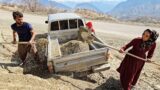 "Wife, angel and sand and stones: collecting and spreading to prevent mud in front of the house"