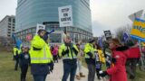 Striking postal workers take their message to Canada Post headquarters