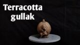 Masterpiece in Clay: Terracotta Gullak Display | Artistic Impression
